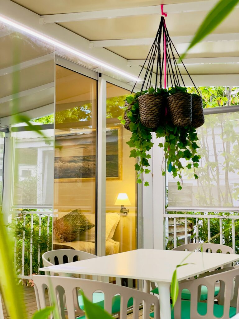 Balcony home decor ideas with green plants, hanging planters, and natural elements