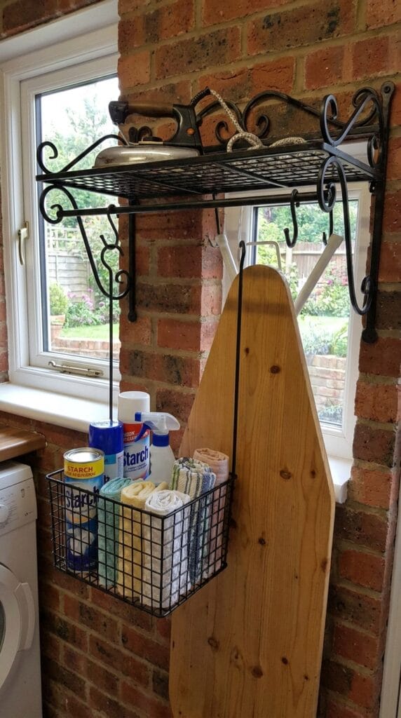 Iron holder mounted on laundry room wall